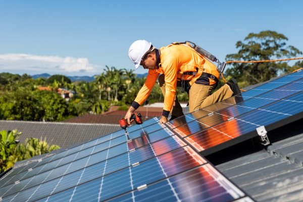 Technician installing solar panels